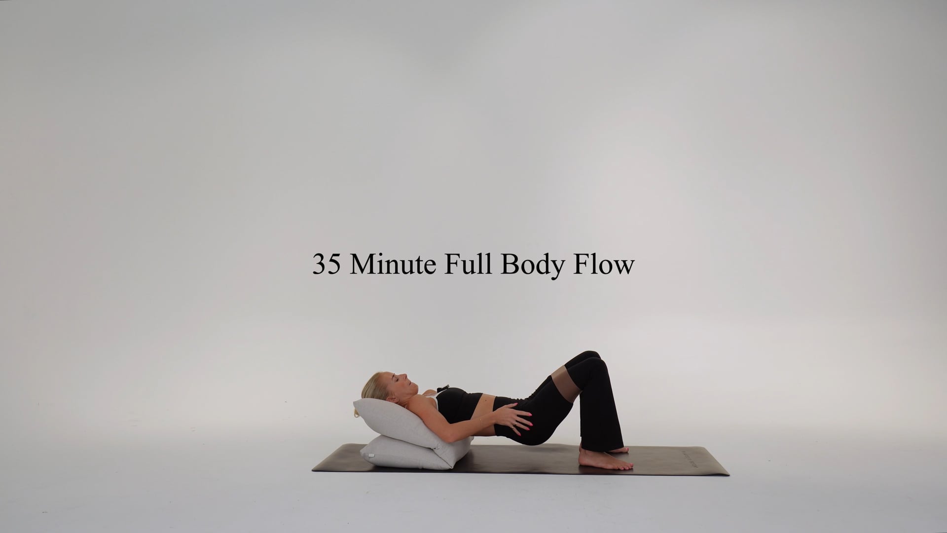 35 minute full body flow using a cushion and band