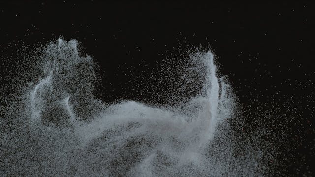 Colorful white particles rising and f...