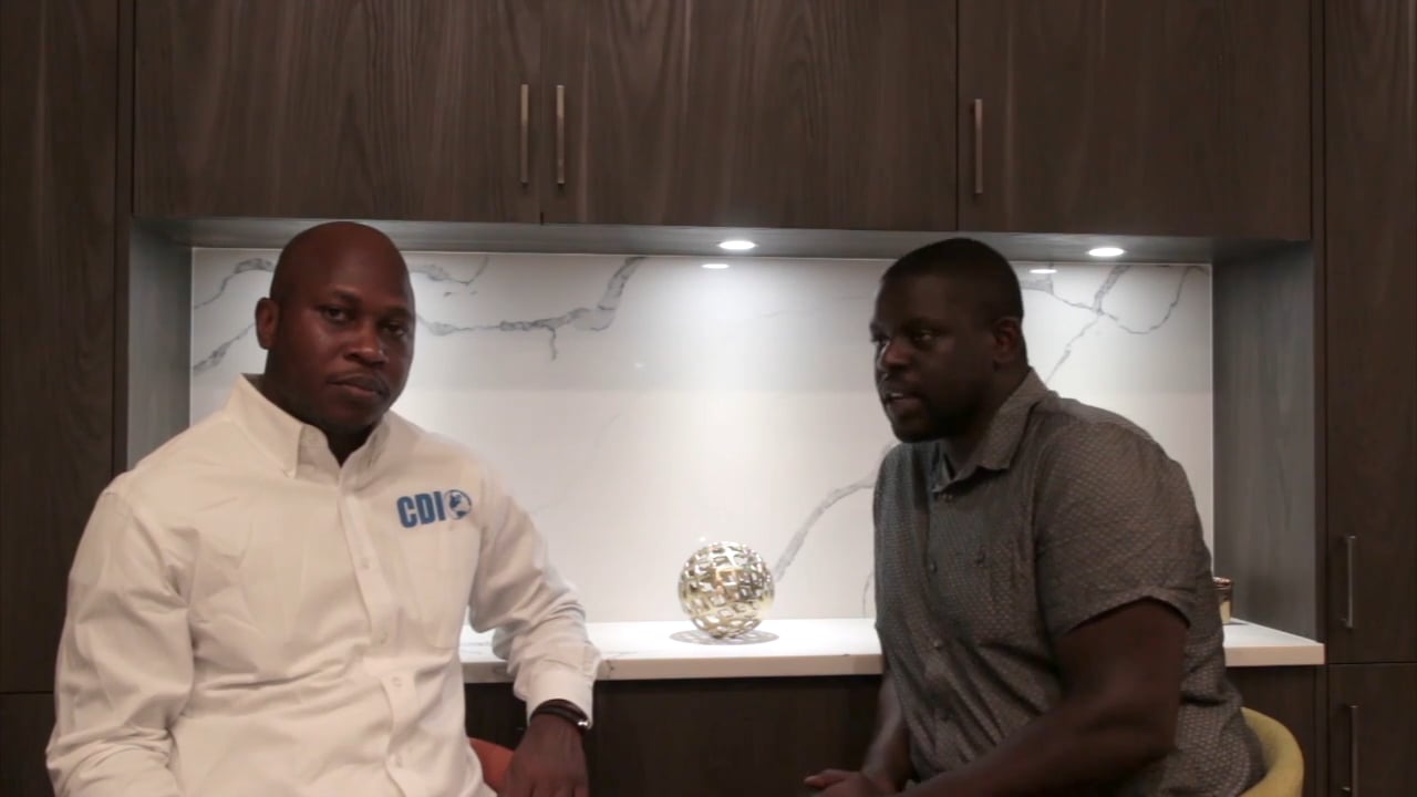 President of Community Development Initiative, Emmanuel Asekame and and Kinyo