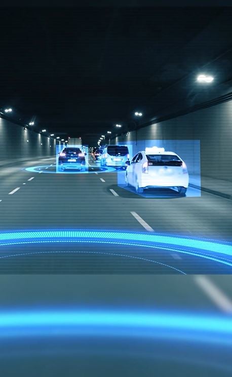 How do driverless vehicles avoid hazards?