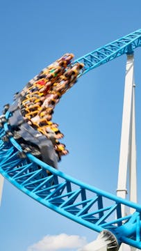 How do rollercoasters stay on the tra...