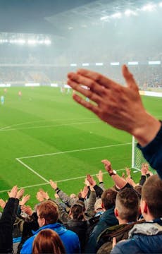 Why do people sing songs at football ...