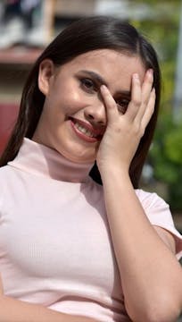 Why do people often smile when nervous?