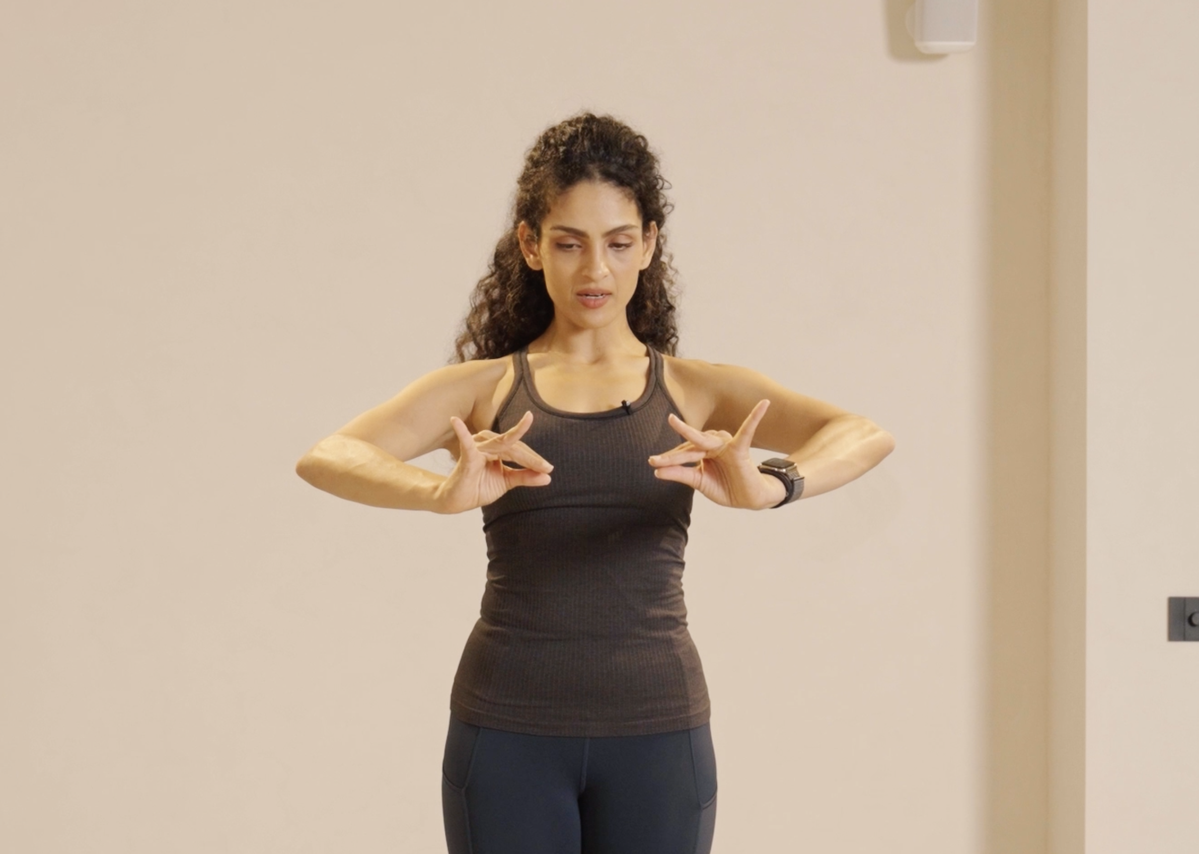 Arms in front of chest