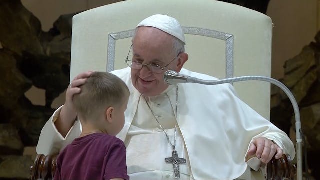 Child runs on stage during Pope Franc...