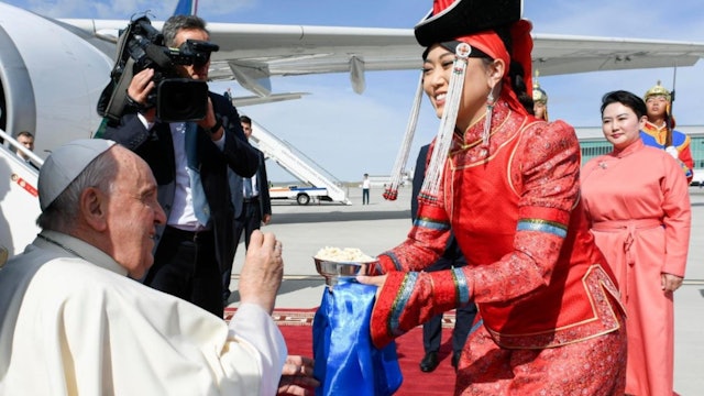Pope Francis is greeted with aaruul upon arriving in Mongolia