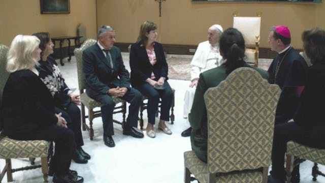 Pope Francis listens to the stories o...