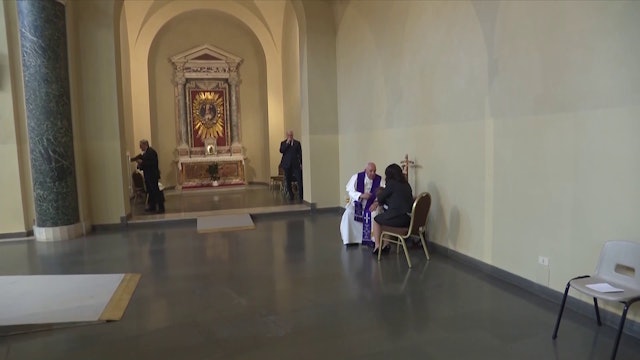 Pope Francis hears confession in a local parish in Rome