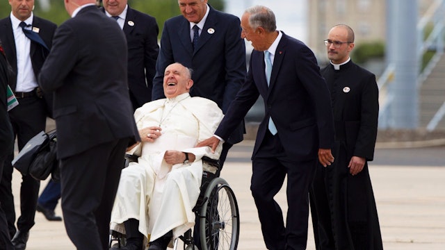Pope Francis and the President of Portugal share an enthusiatic greeting