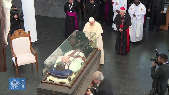 Pope Francis prays before the tomb of...
