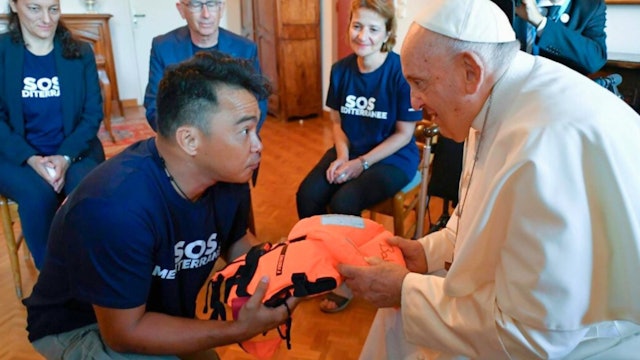 Pope receives child's life jacket during one of private meetings in Marseille