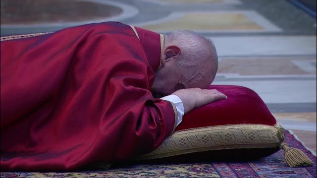 Pope Francis prays prostrate in St. P...