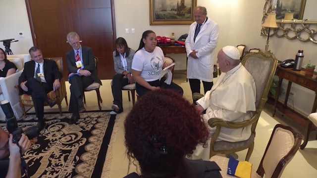 Pope Francis listens attentively to song composed by a young victim of bullying