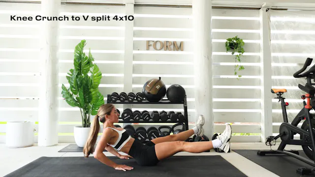 KNEE CRUNCH TO V SPILT (4x10) 