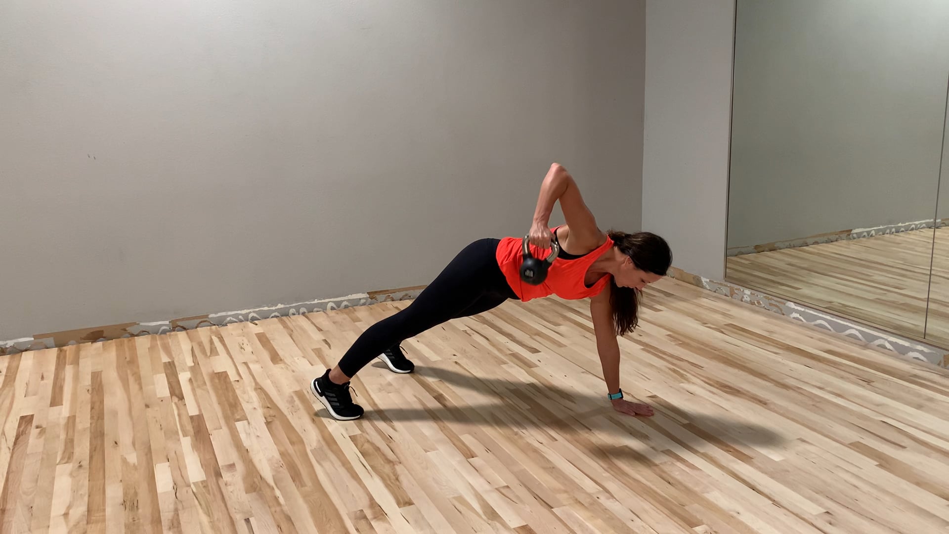 Plank with single arm KB row 