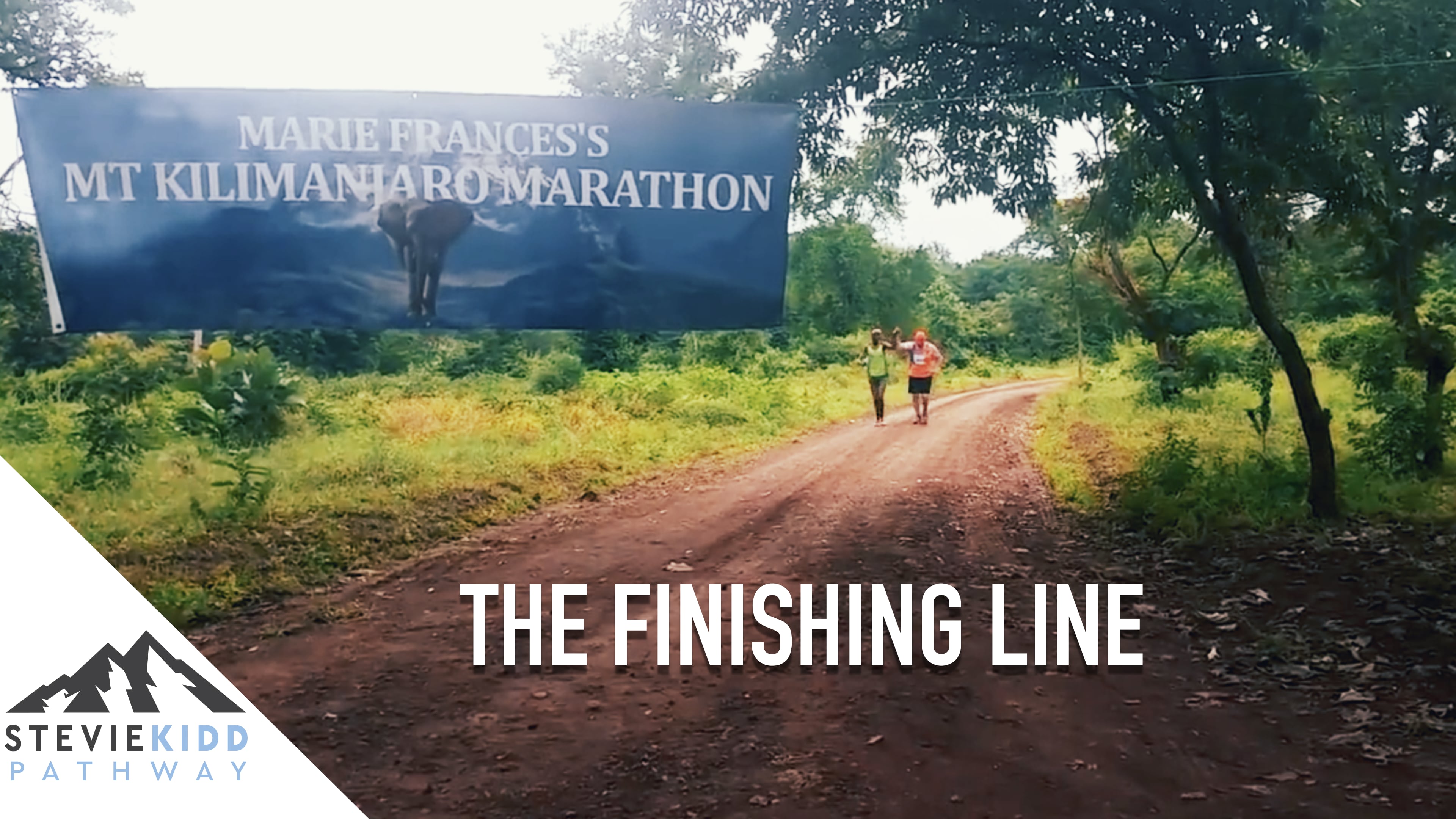 Stevie Kidd Crossing The Kilimanjaro Marathon Finishing Line
