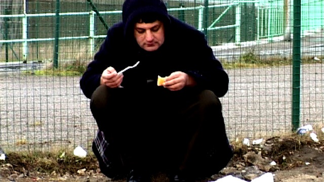 Calais Still - Ijaz eating bread