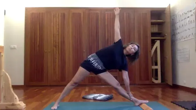 6-1-26 Gulnaaz Yoga Club Trikonasana, Parsvakonasana top hand holds something fixed to extend more, stay longer and go deeper.