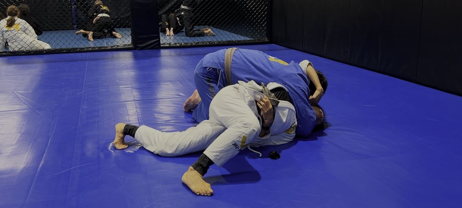 Escaping the Arm Triangle hold by bridging away