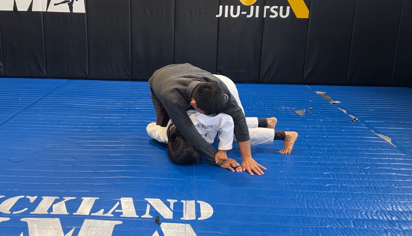 Turtle sweep using back bump to side control or knee ride
