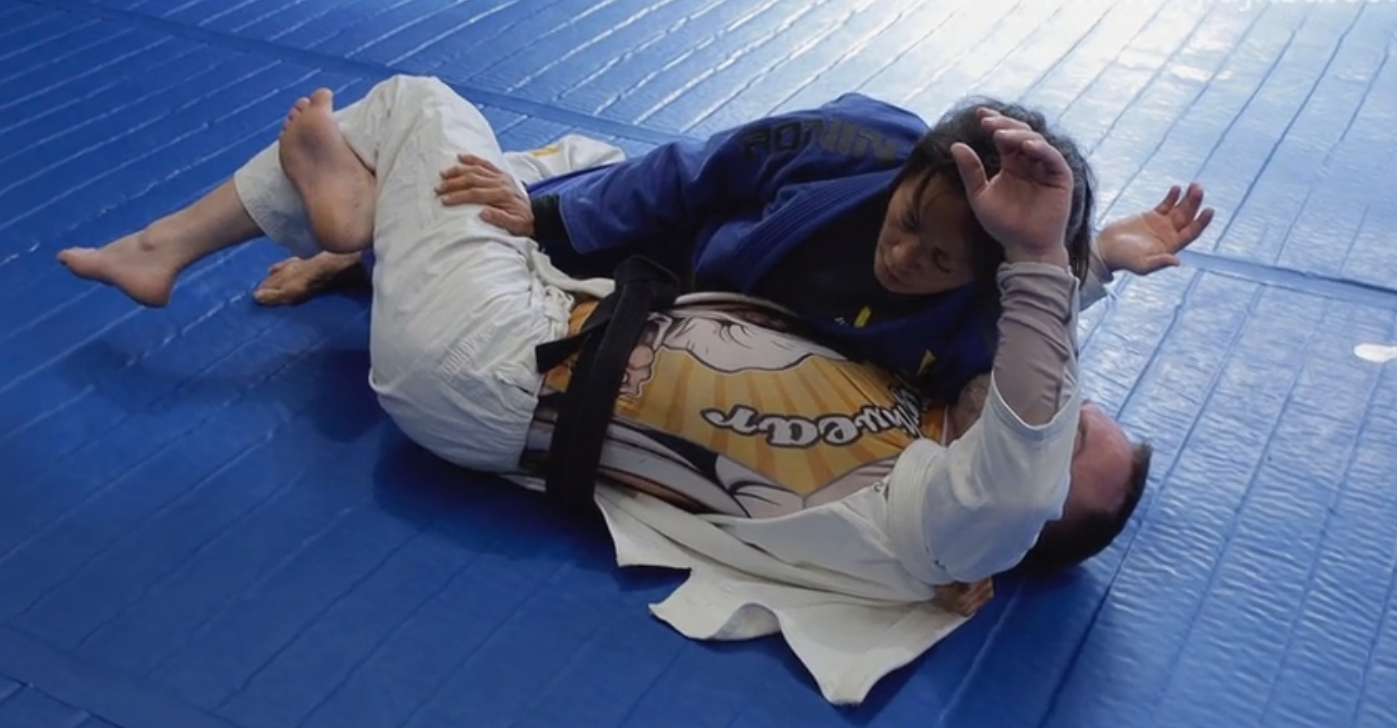 Half Guard Pass using opponent's lapel