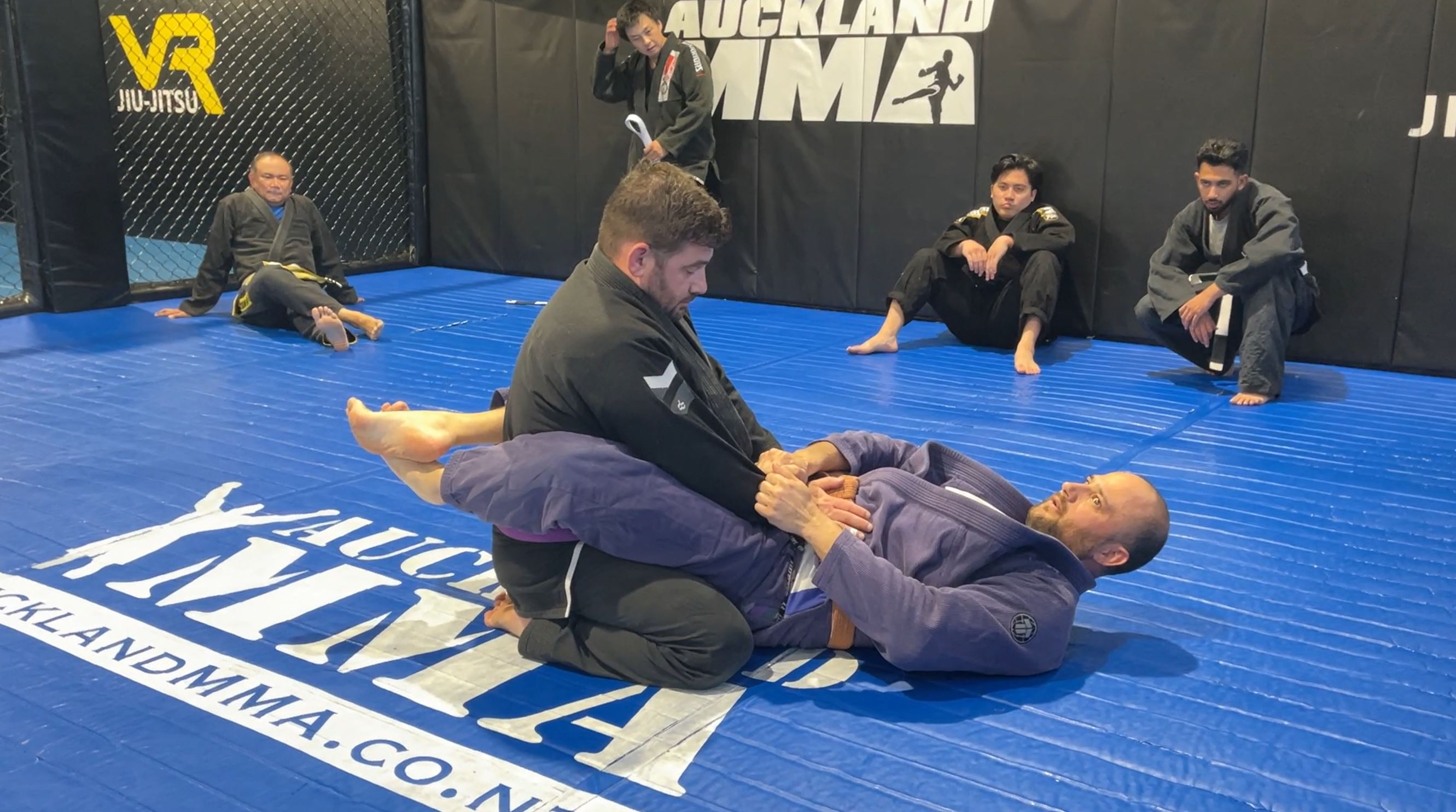 Hip Bump Sweep from Closed Guard using Cross Sleeve grip