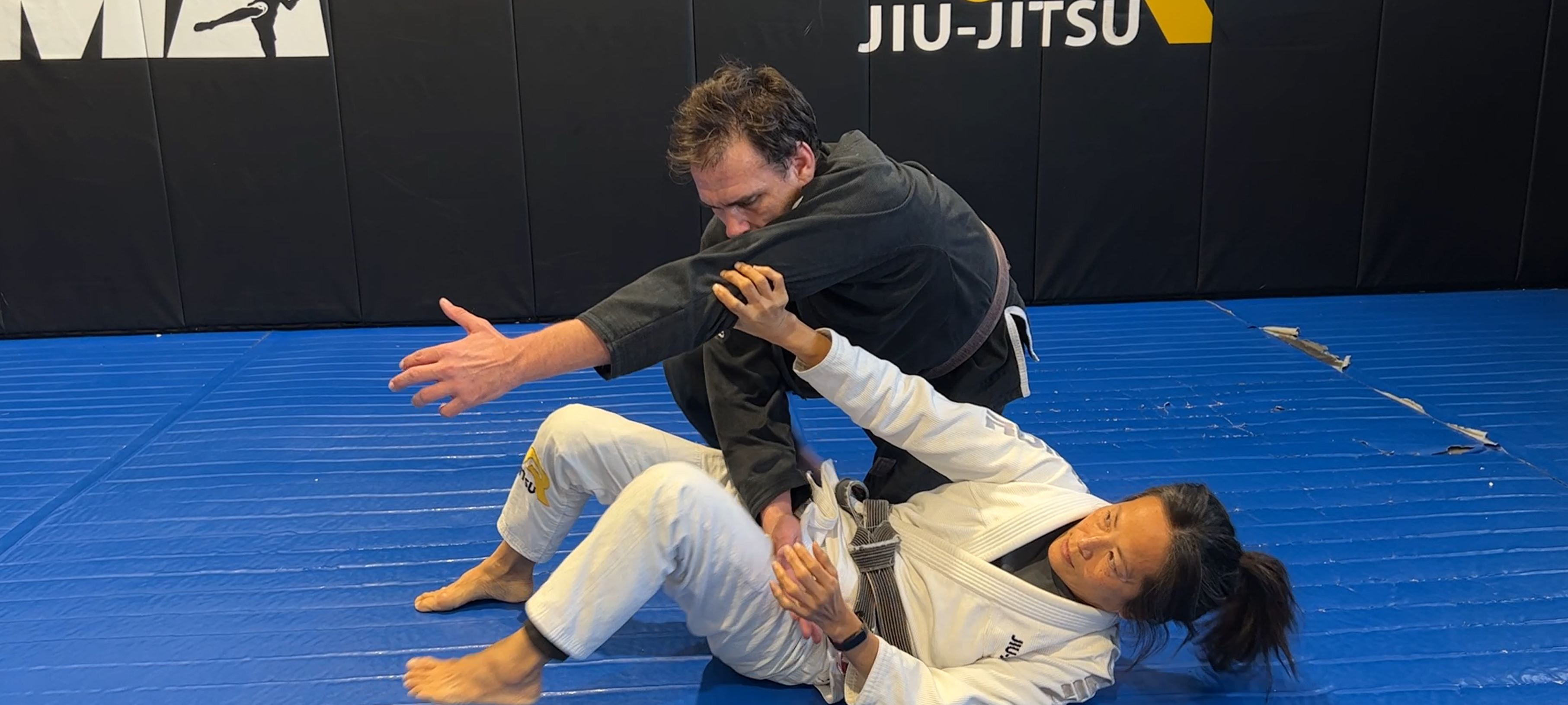 Switching Stiff Arm directions to escape side control