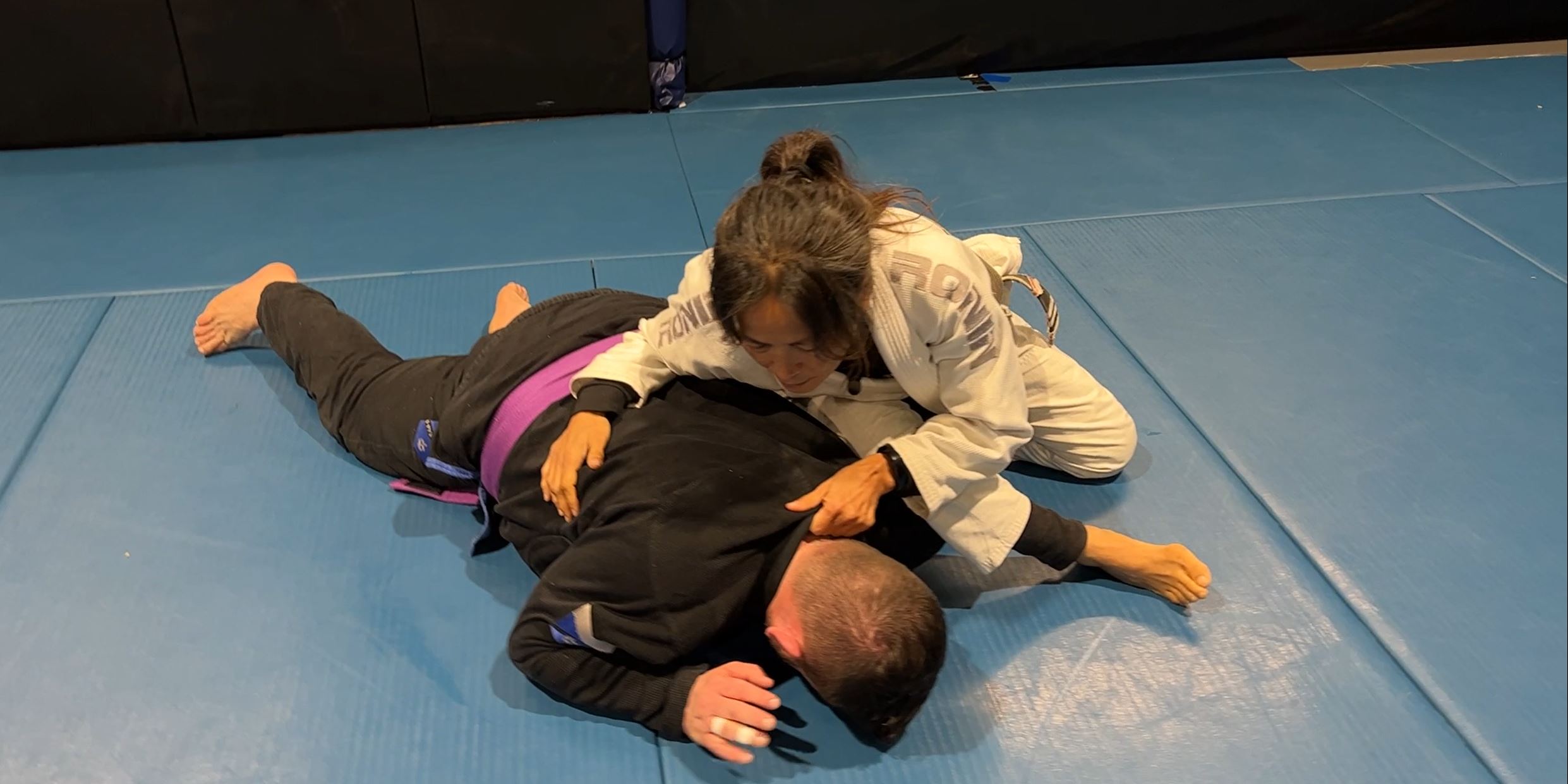 Omoplata from Side Control when opponent turns in with underhook