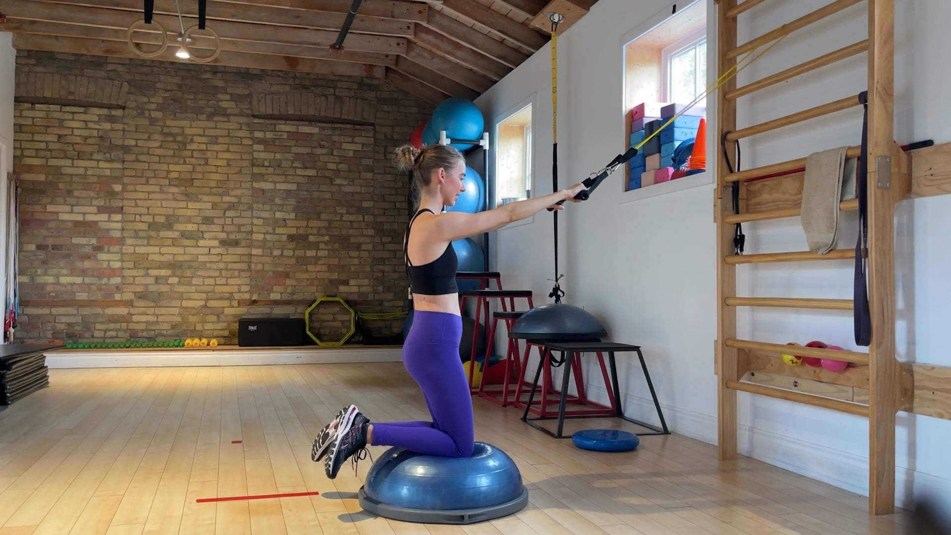 Elite: Straight arm lat pull downs kneeling on bosu exercise