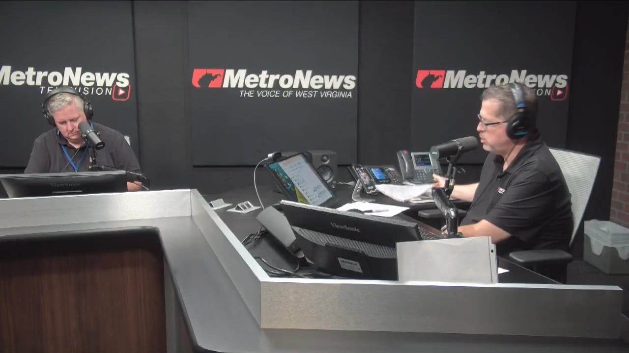 Dave A Steven Allen Adams talking about flood damage